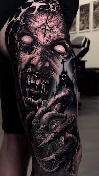 Thigh tattoo of a screaming demon with blank eyes, a clawed hand, and soft pink shading.