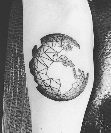 Bold crescent moon made of small triangles breaking apart on the forearm