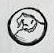 Small spooky face inside a circle drawn with sketchy black lines.
