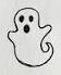 Narrow ghost outline with dark oval eyes and a tiny mouth.