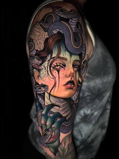 Colorful sleeve showing Medusa with wide eyes, dark lips, purple snakes, green shadows, and a curled hand below.