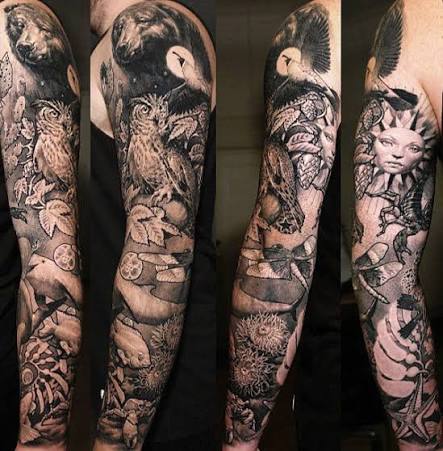 Black and gray sleeve with a bear, an owl, and leaves winding down the arm