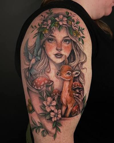 Flower crowned woman above a fawn, with mushrooms and leafy branches on the upper arm