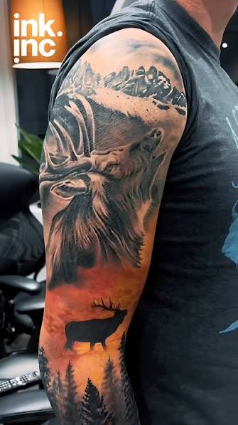 An elk face and wide antlers fill the upper arm above snowy peaks and a second elk against an orange sky.
