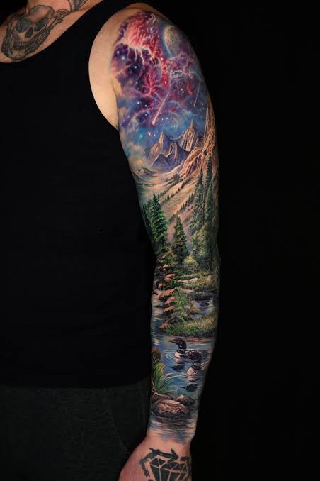 Colorful galaxy above mountains, with a river, pine trees, and two ducks extending down the forearm.