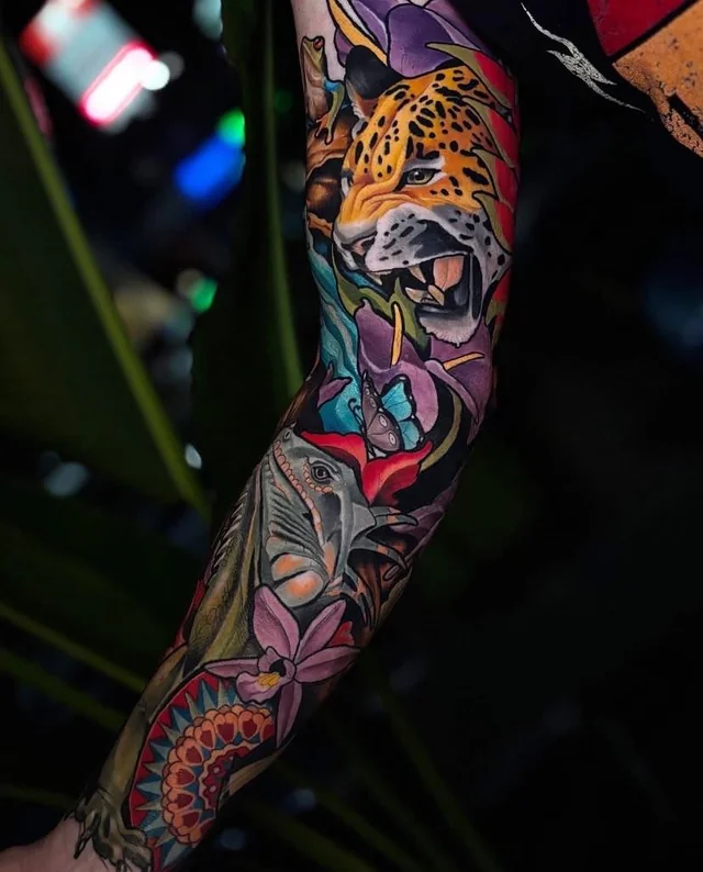 A roaring jaguar sits above an elephant, surrounded by a butterfly and colorful jungle flowers.