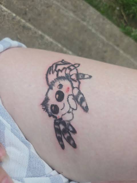 Whimsical cartoon spider with stitched limbs and pink cheeks on the thigh.